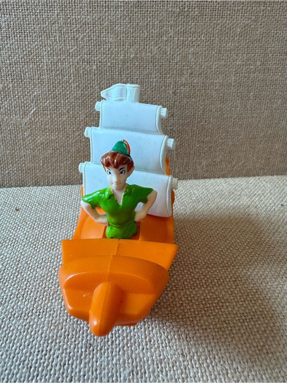 Green Peter Pan Figure on Orange Sailboat Kids Toy